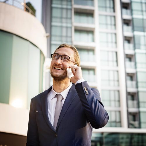 business-man-outdoors-phone-call-concept-PWYTNSG.jpg